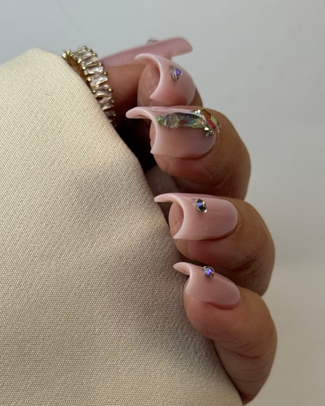 Glitter nude luxury square nails with crystal nail art – premium nail styling UK
